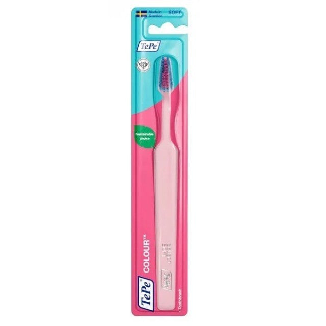 Pink toothbrush with TePe branding in a clear packaging on a white background